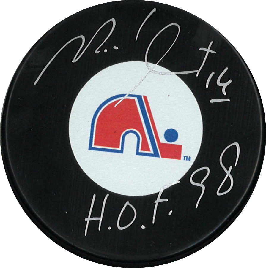 Michel Goulet autographed NHL puck from the Quebec Nordiques with inscription