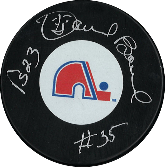 Daniel Bouchard autographed NHL puck from the Quebec Nordiques with inscription
